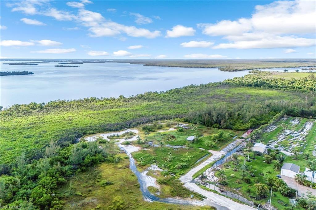 Image 3: Aerial overview of property's location with a nearby body of water