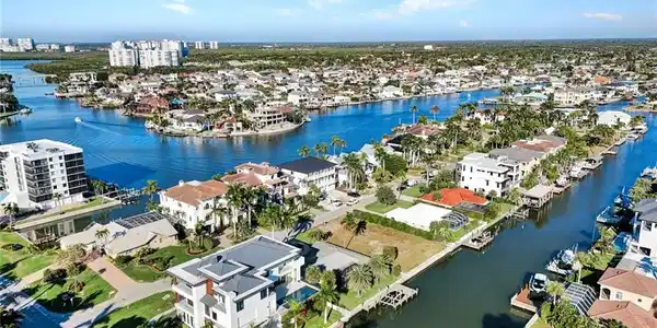 Image 3: View of urban area featuring a large body of water