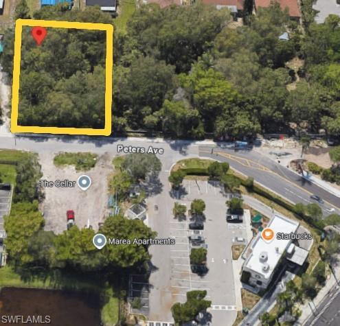 Image 3: Aerial view of property's location featuring property parcel outlined