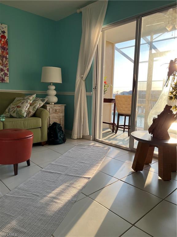 Image 4: Living room to screened lanai and pool.