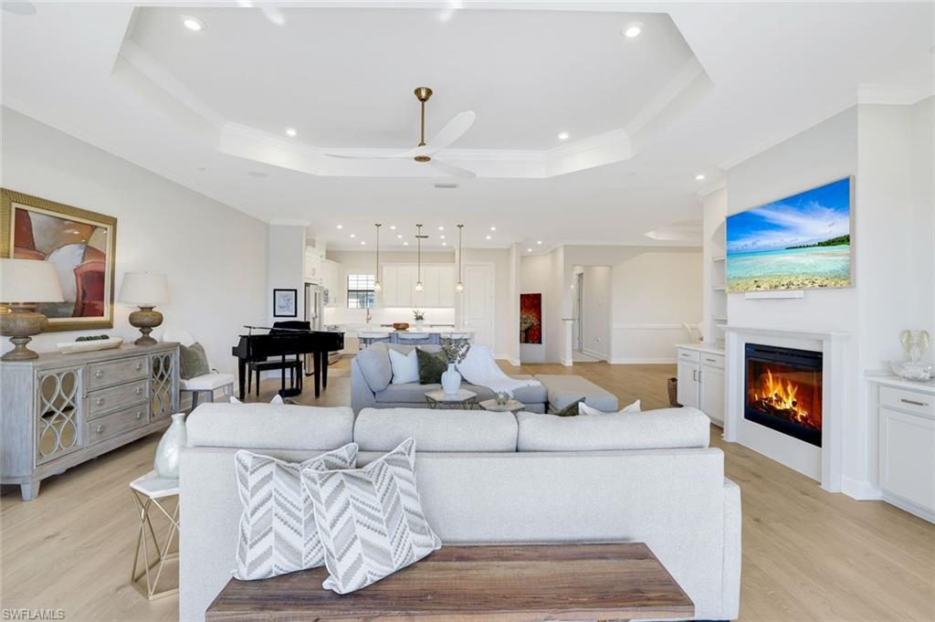 Image 1: Elegant open-concept great room showcasing designer finishes, soaring ceilings, and seamless indoor-outdoor living.