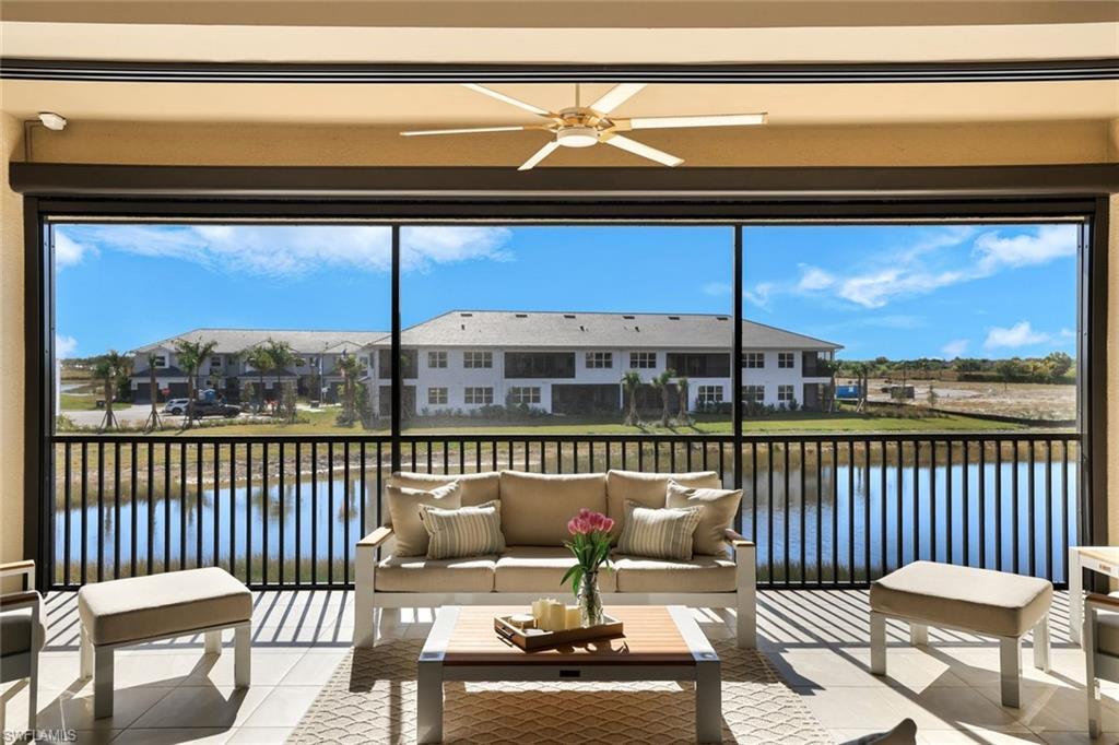 Image 3: Covered lanai overlooking tranquil water views&mdash;an inviting space for relaxing or entertaining outdoors.