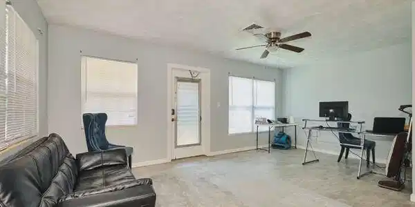 Image 4: Living area featuring an office area and ceiling fan
