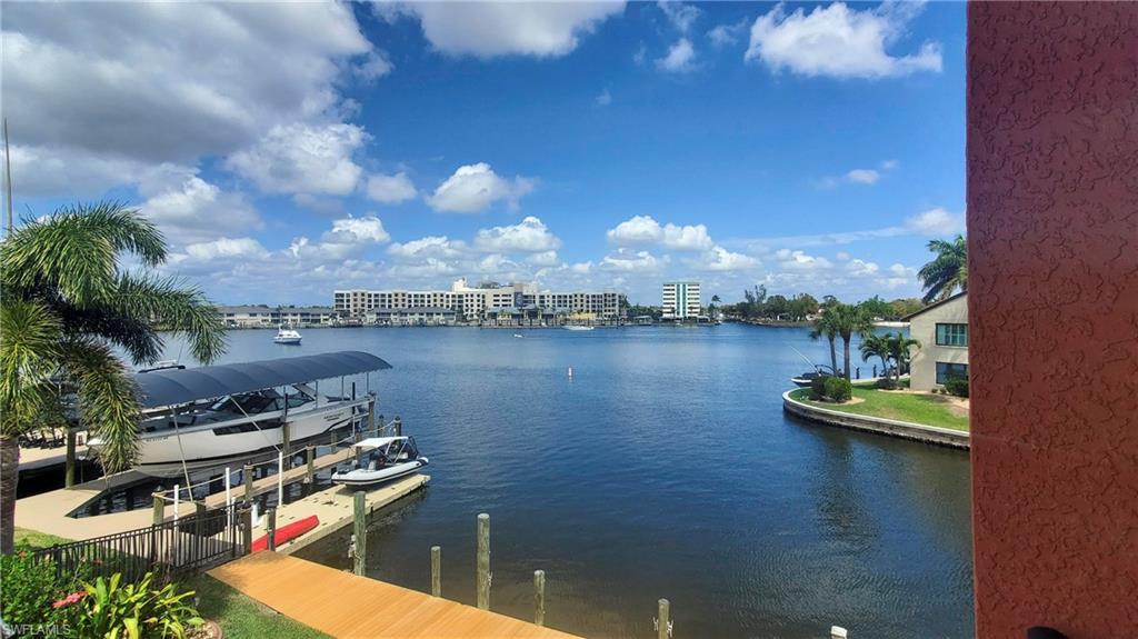 Image 4: View from lanai. The Bimini basin is over 900 feet wide here. One of the widest non-river views in Cape Coral. New waterfront restaurant across the basin.