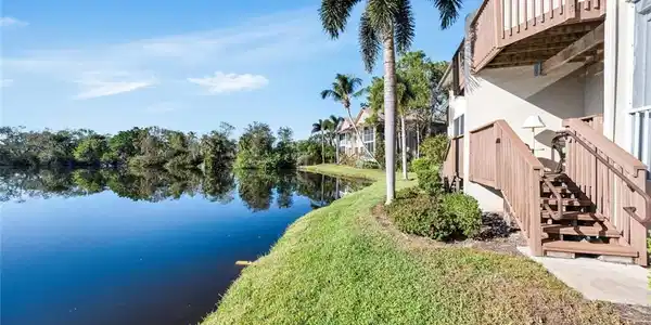 Image 4: Back of home looking at water and deck