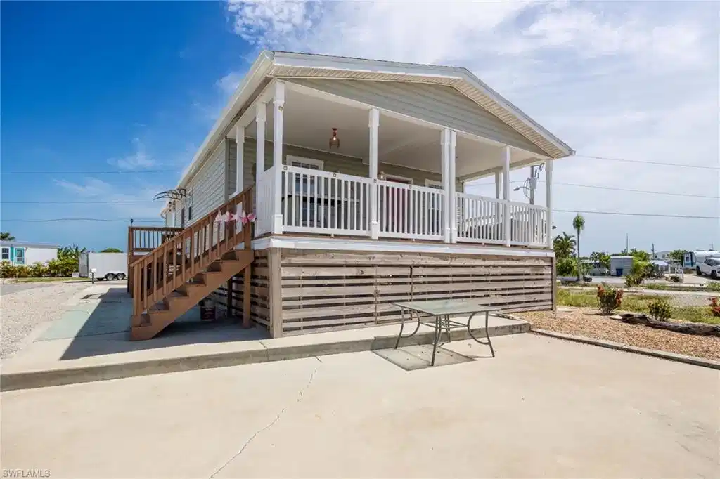Image 1: Rear exposure facing the canal with ample entertaining area.