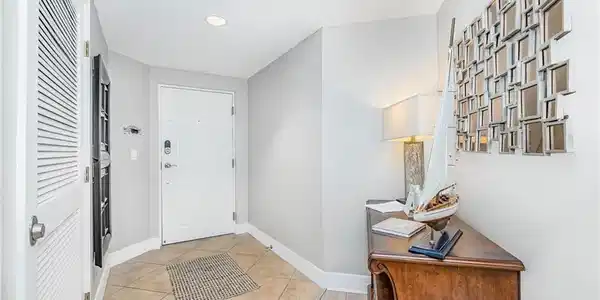 Image 3: Foyer featuring light tile patterned floors and recessed lighting