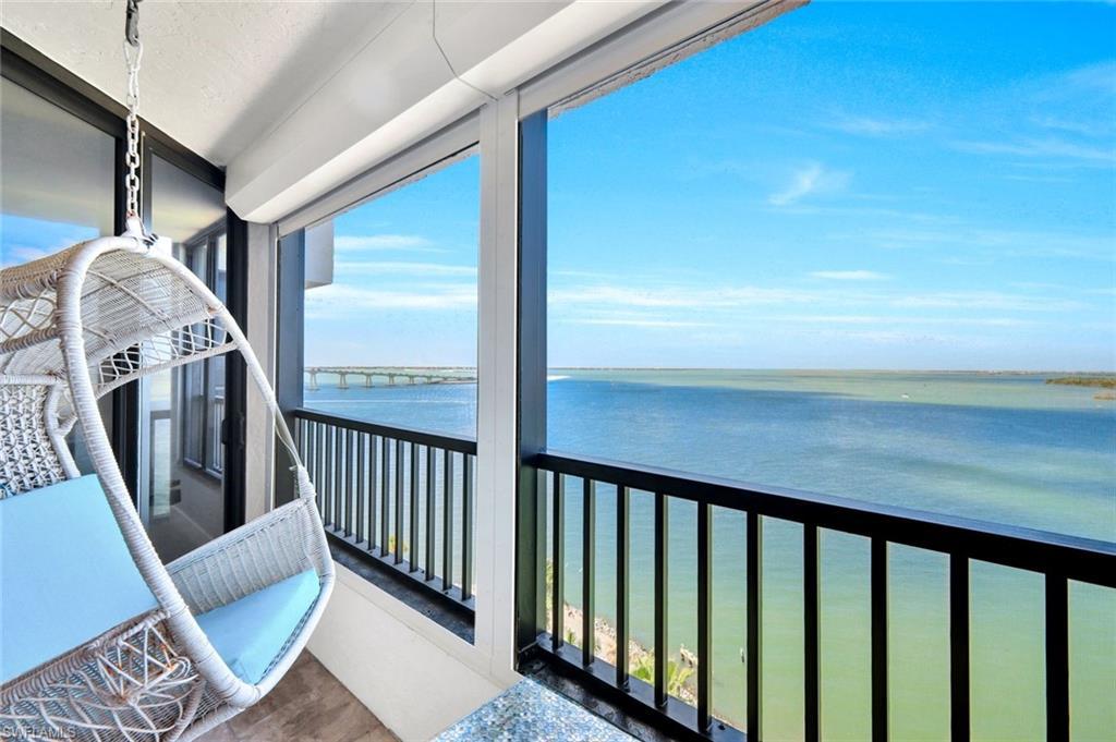 Image 2: Balcony featuring a water view