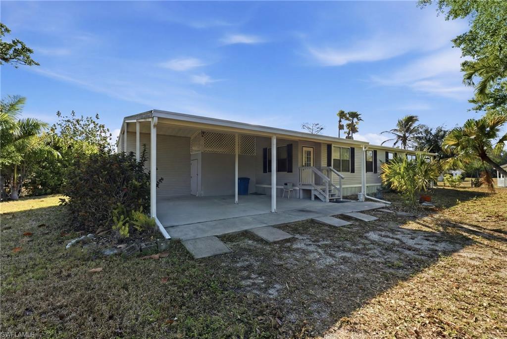 Image 2: Rear view of house featuring a patio area