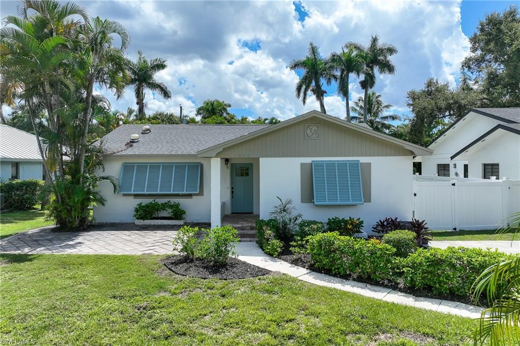 Image 1: Single story home with stucco siding and roof with shingles