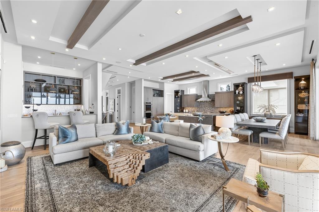Image 3: Open concept-view of living area, wet bar, kitchen & dining