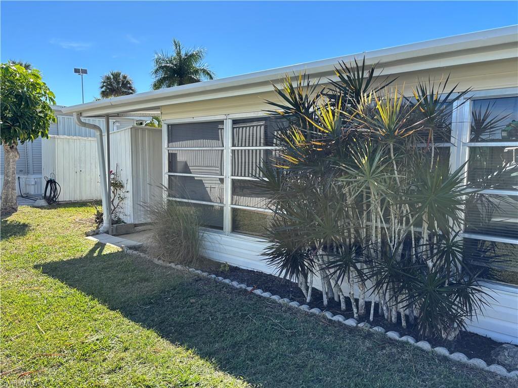 Image 3: View of side of property with a yard
