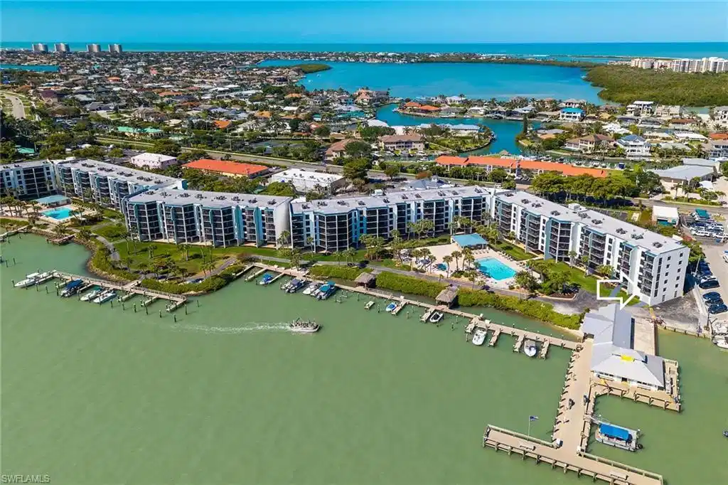 Image 1: Birds eye view of property with a water view