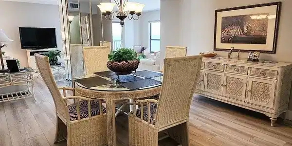 Image 3: Dining room with a chandelier and light wood finished floors