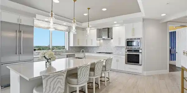 Image 3: Gas stovetop, a huge island, pendant lighting, TWO sinks and so much more!