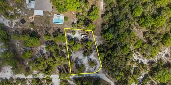 Image 4: Aerial overview of property's location featuring property parcel outlined
