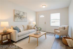 Image 2: Living area with wood finished floors