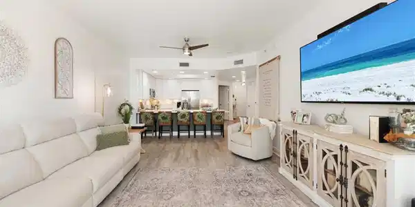 Image 4: Living area featuring light wood-type flooring and ceiling fan