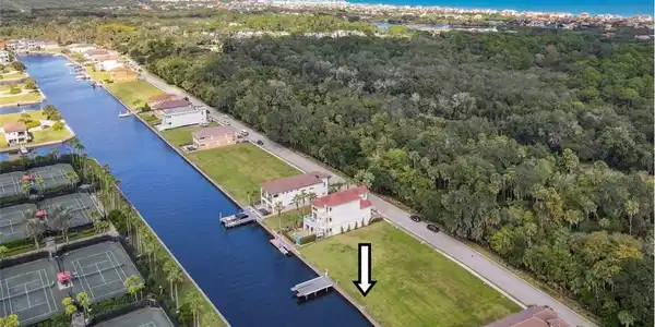 Image 2: Drone / aerial view of a large body of water and a forest