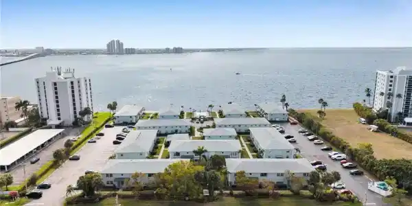 Image 3: Bird's eye view of a large body of water and apartment complex