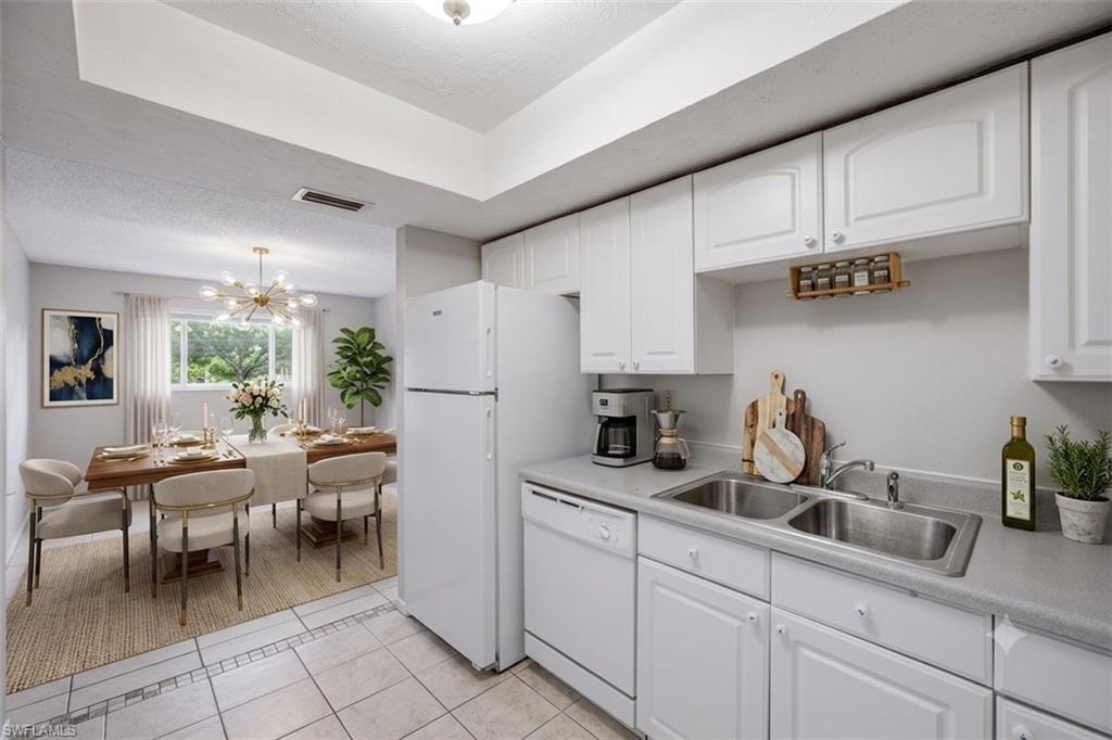 Image 4: Virtually staged photo showing kitchen out to dining area.