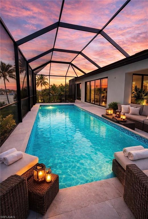 Image 2: Outdoor pool with a sunroom, a lanai, outdoor seating, and a patio area (Rendered photo)