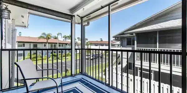 Image 2: Balcony featuring a sunroom