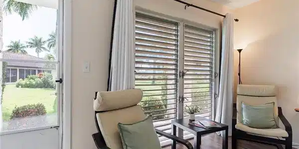 Image 4: Sitting room with plenty of natural light, wood finished floors, and a textured ceiling