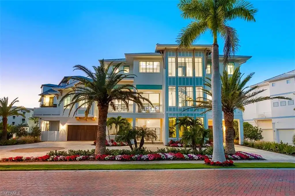 Image 1: View of front of property featuring decorative driveway