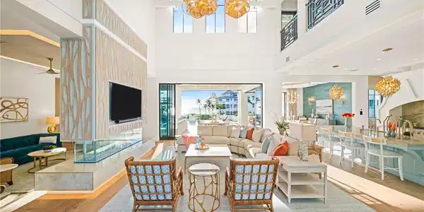 Image 3: Living area featuring a chandelier, light wood finished floors, healthy amount of natural light, and wooden ceiling