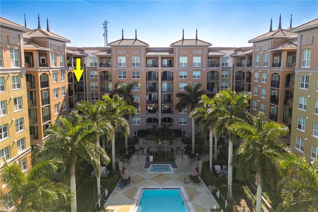 Image 2: View of apartment building / complex with a community pool