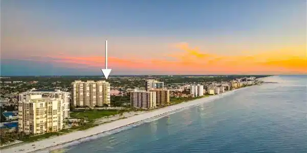 Image 2: Aerial view at dusk of view of water and beach and a view of city