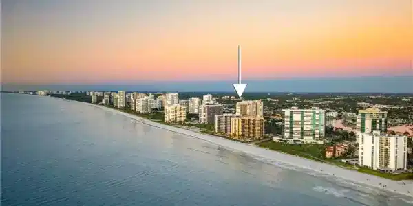 Image 3: Aerial view at dusk of view of water and beach and a view of city