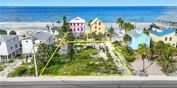 Image 2: Aerial view of residential area featuring extended coastline