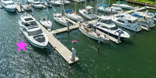 Image 3: Dock featuring view of marina and a water view