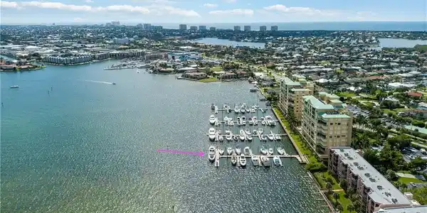 Image 4: View of urban area with a nearby body of water and a marina