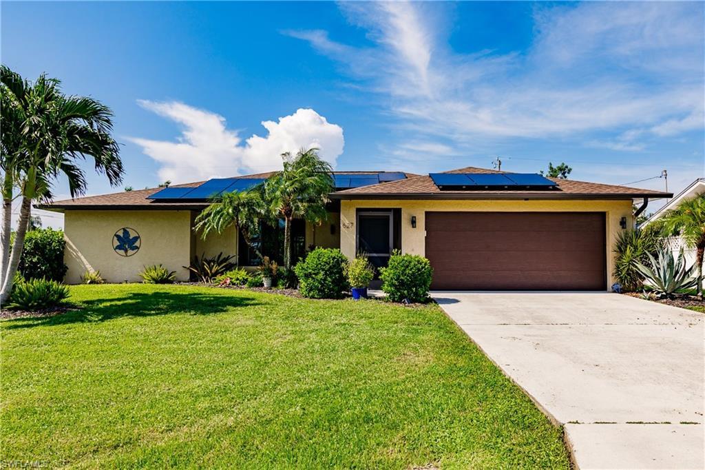 Image 1: Gorgeous home on large corner homesite.  New roof, solar panels, great landscape, rear yard screened in pool with huge lanai.  Great place.