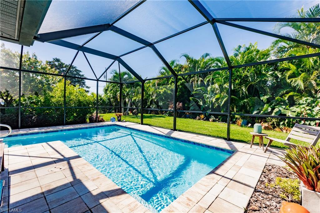 Image 2: View of swimming pool with a lanai