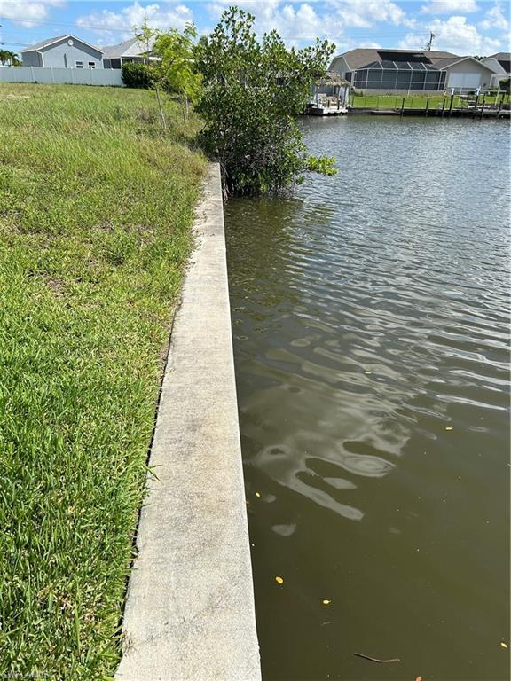 Image 3: Dock featuring a water view