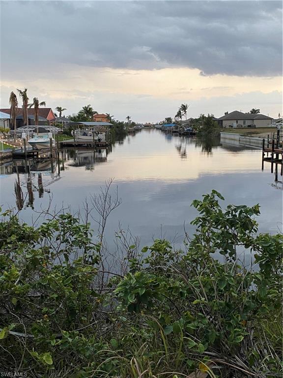Image 2: Water view featuring a boat dock