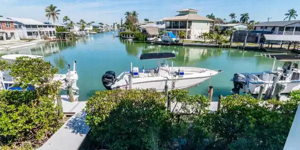 Image 2: Dock with a water view, a residential view, and boat lift