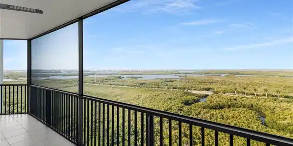 Image 4: Balcony with a water view and a sunroom
