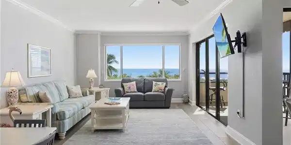 Image 2: Living room with a ceiling fan, light wood-style flooring, and crown molding
