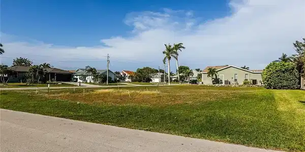 Image 2: View of asphalt street featuring a residential view