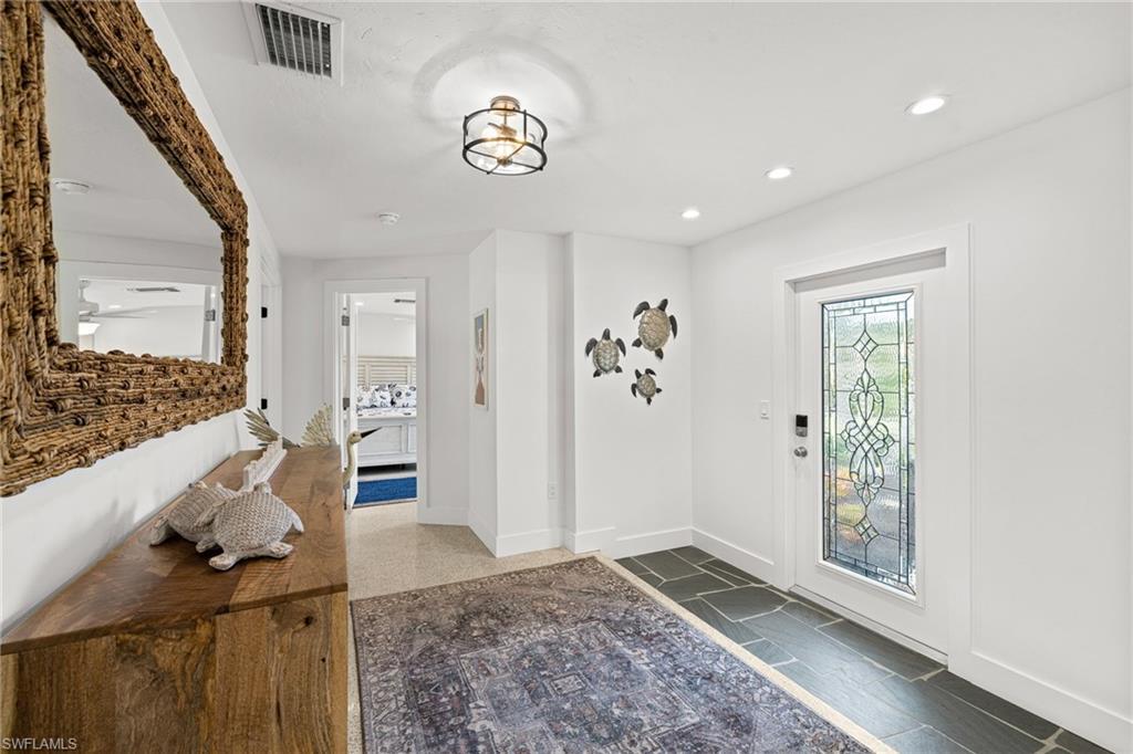Image 3: Entryway with baseboards and recessed lighting