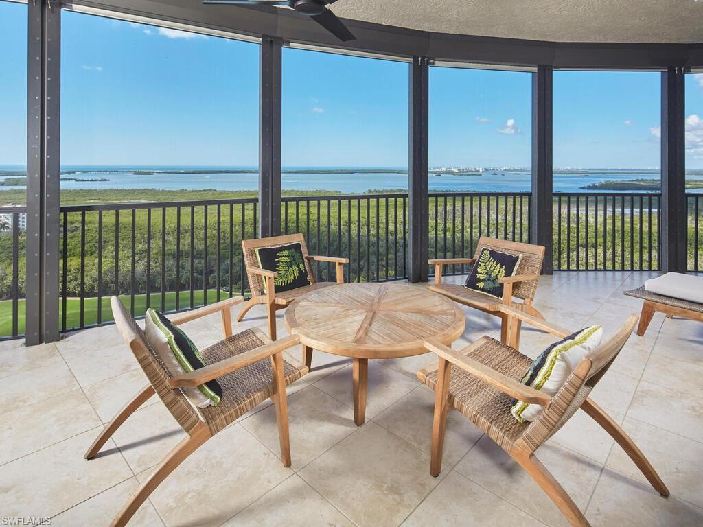 Image 2: Sunroom / solarium featuring a water view, floor to ceiling windows, and tile patterned flooring