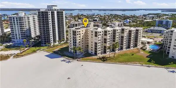 Image 3: Beautiful beaches of FMB, community pool of Sandarac.  Photo may be digitally enhanced.
