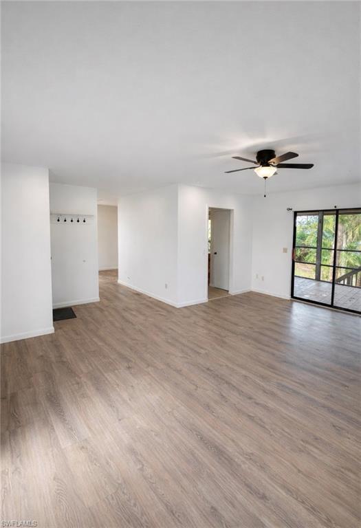 Image 4: Unfurnished room with light wood-style floors and ceiling fan