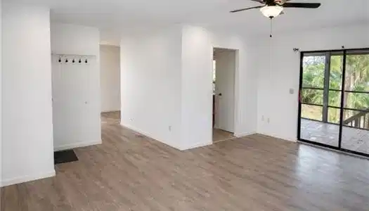 Image 4: Unfurnished room with light wood-style floors and ceiling fan