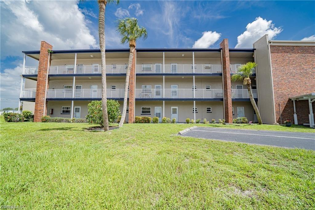 Image 3: View of apartment building / complex with uncovered parking